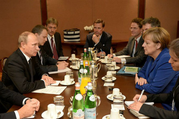Путин и Меркель “сверили часы” в Милане 